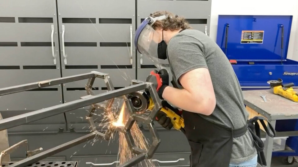 User grinding metal as sparks fly